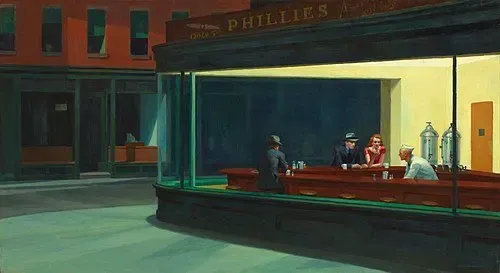 Edward Hopper’s Nighthawks, showing isolated figures in a diner framed by architecture and negative space.