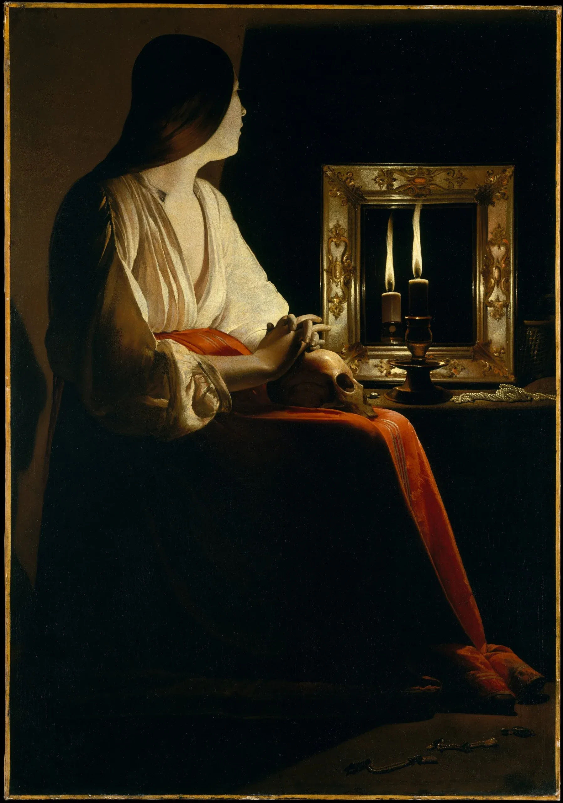 Georges de La Tour’s The Penitent Magdalene, lit by a single candle source in a dark room.